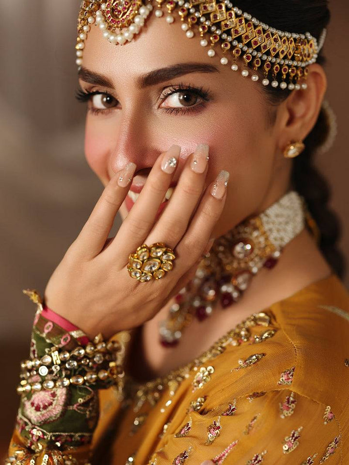 Bridal portrait showcasing wedding attire and jewelry