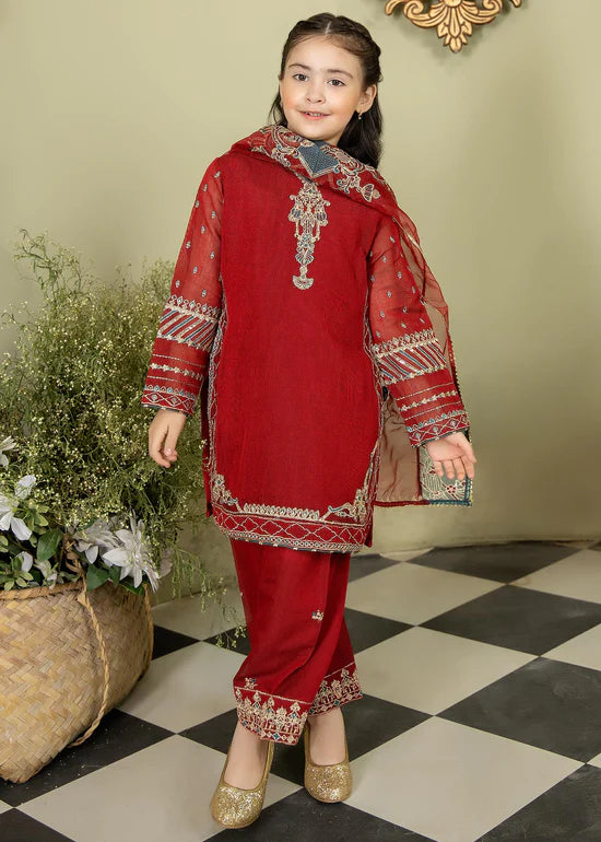 a young girl in a red outfit standing on a checkered floor