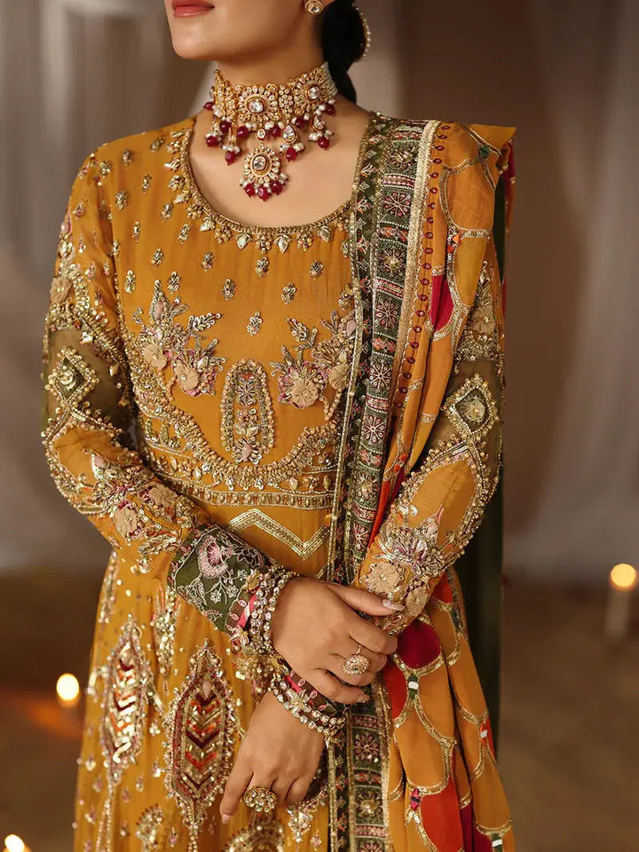 Detailed view of yellow dress with floral designs