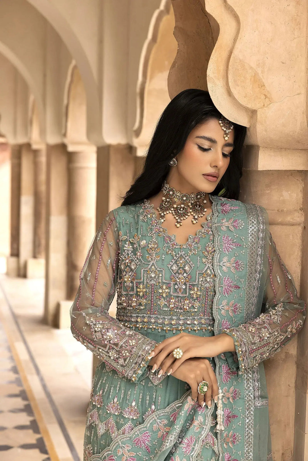 Side pose of AR-114-1300 Maxi - Pakistani Women Luxury | Handwork, Embroidery featuring pastel tones, floral threadwork, and elegant net dupatta.