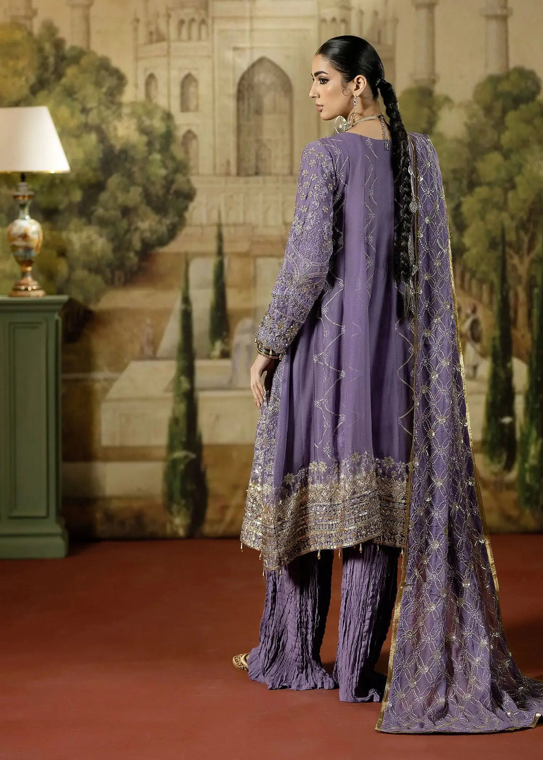 Back view of RANGREZA PURPLE embroidered chiffon Pakistani party dress with intricate gold embroidery and matching dupatta and pleated bottoms.