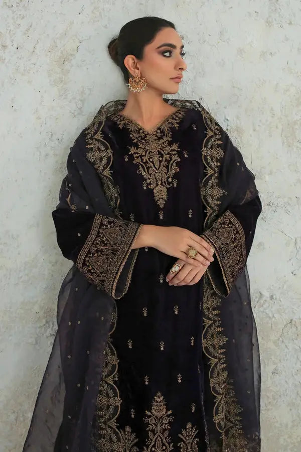 Side profile of Embroidered Velvet SF-239 outfit, emphasizing the rich velvet texture and gold embellishments on the dupatta and sleeves.