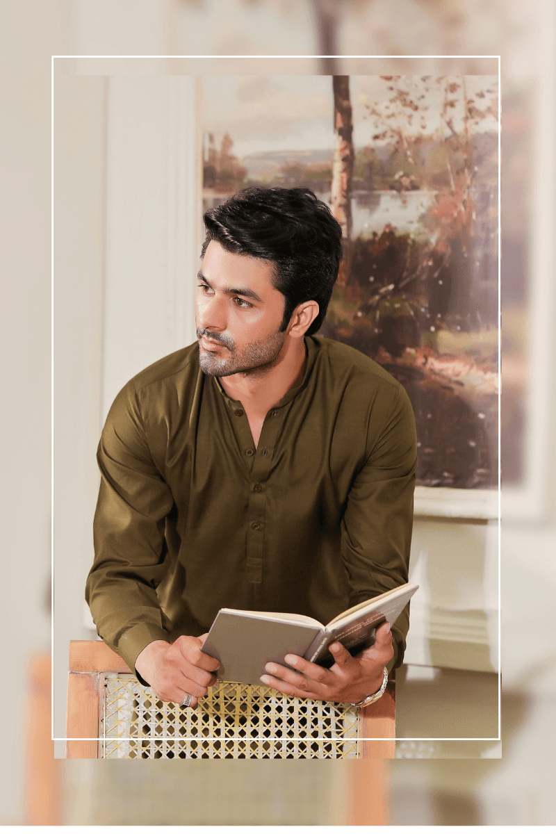 Exclusive Green - Mens Shalwar Kameez Blended Fabric MA-103 captured in a seated pose, showcasing the elegant fit and rich texture of the traditional outfit.