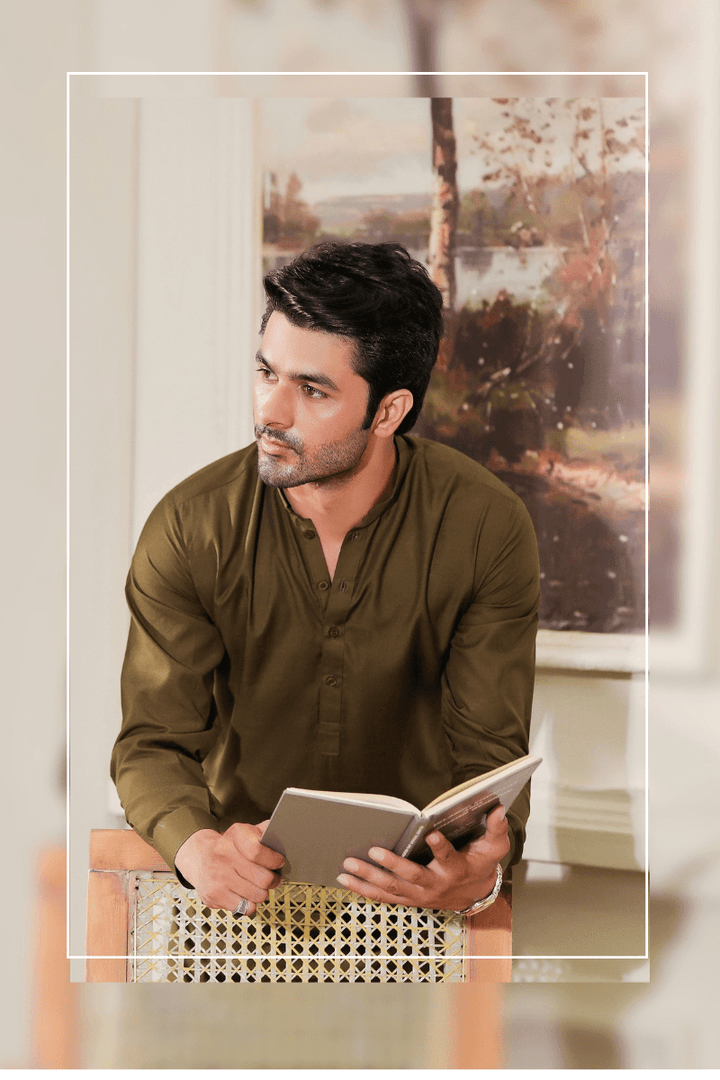 Exclusive Green - Mens Shalwar Kameez Blended Fabric MA-103 captured in a seated pose, showcasing the elegant fit and rich texture of the traditional outfit.