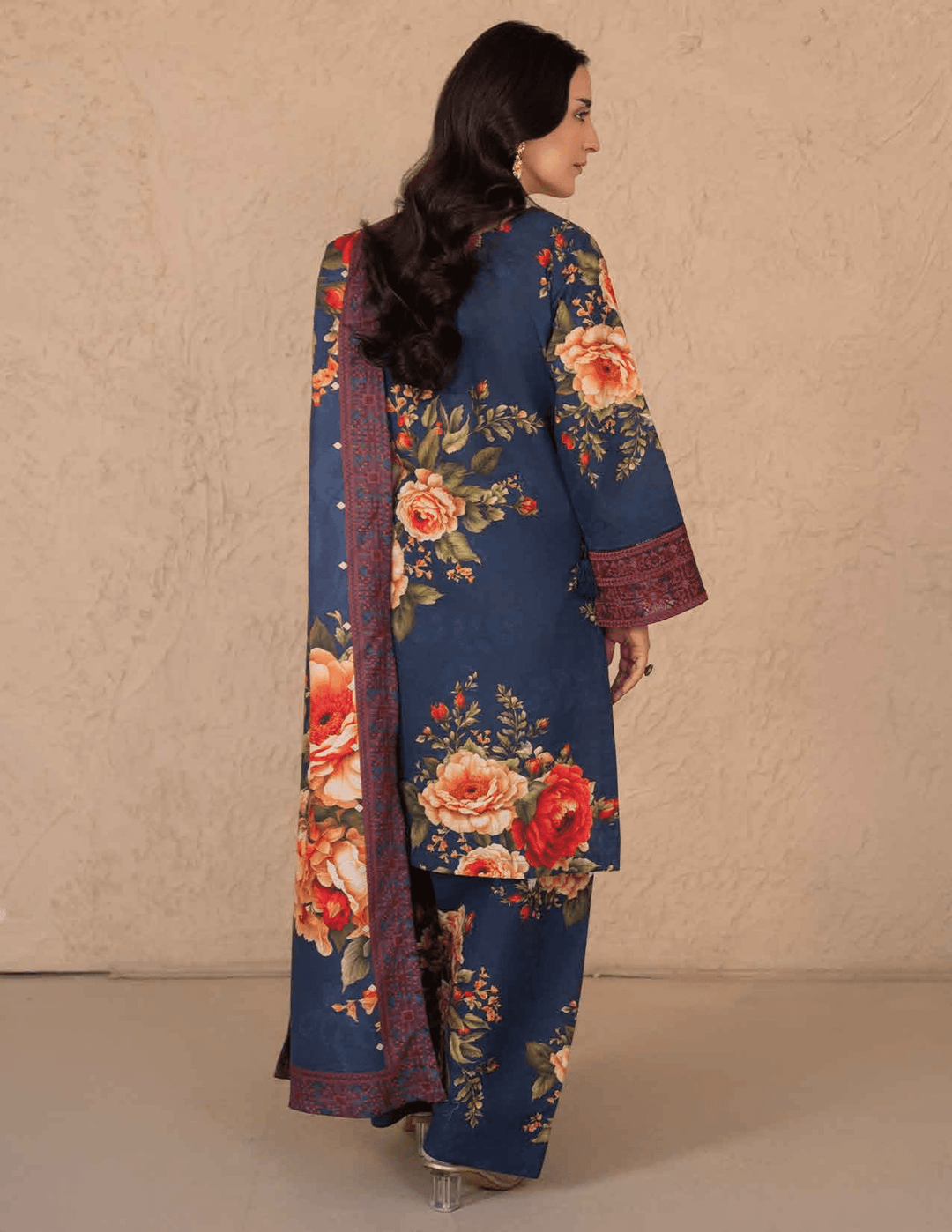 Back view of RANGREZA ML-197-5404 stitched 3-piece winter suit with bold floral print and embroidered borders on shirt and dupatta for women in the USA.