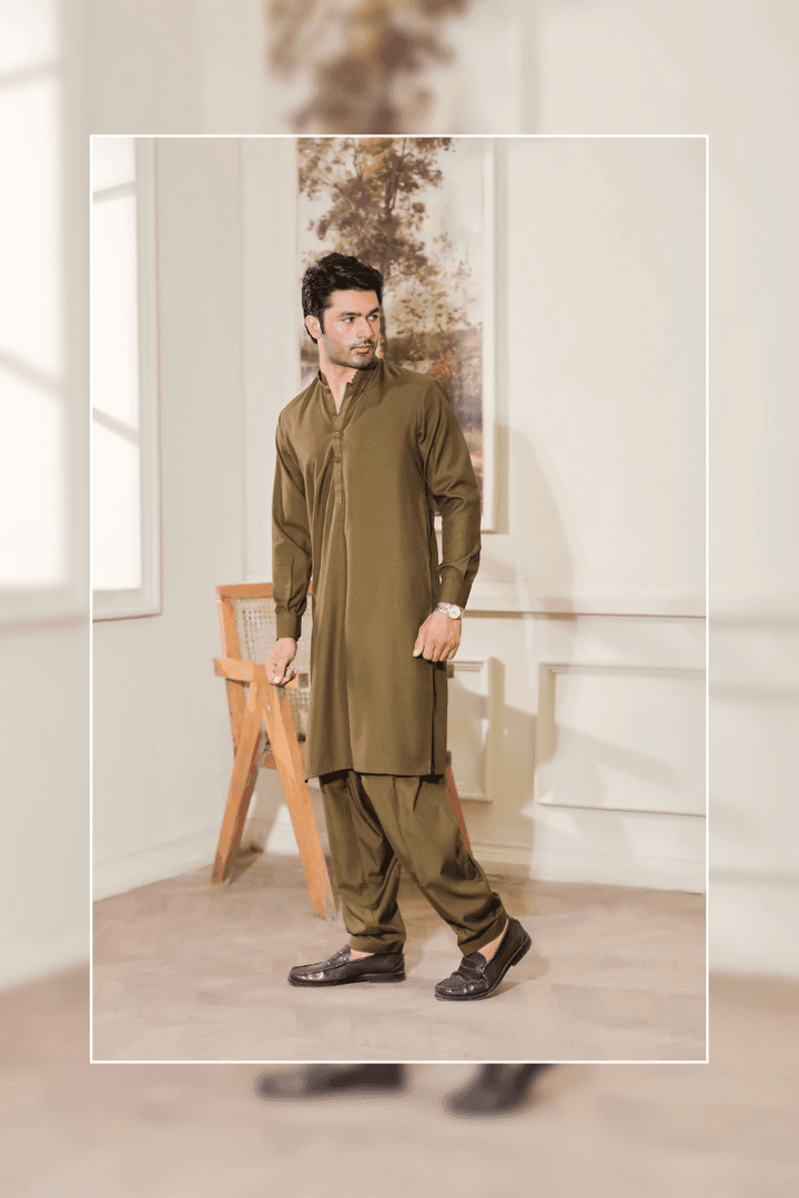 Exclusive Green - Mens Shalwar Kameez Blended Fabric MA-103 modeled in a walking pose, reflecting the comfort and graceful drape of the fabric.