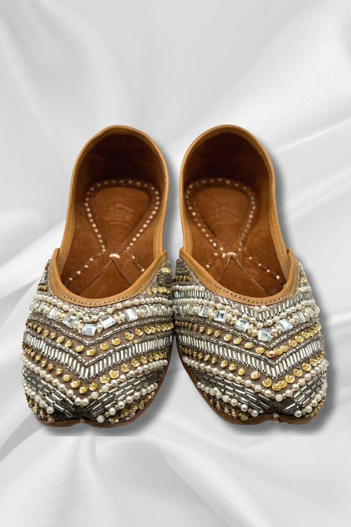 Naqshi Silver Jutti - Pakistani Khussa Shoes with intricate silver floral embroidery, pearls, and velvet base, ideal for weddings and festive wear.