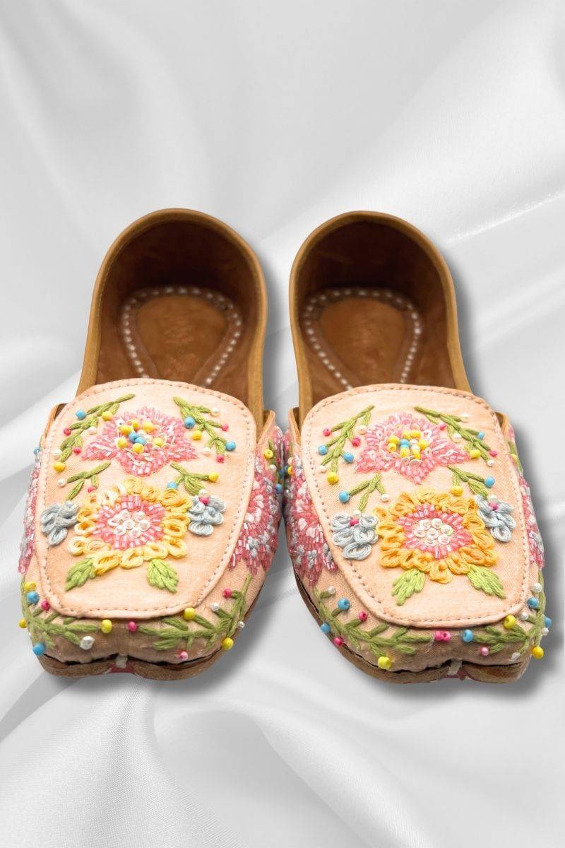 Front view of Rangrez Peach Jutti - Chic square-toe Pakistani Khussa with multicolor threadwork and handcrafted detailing for elegant footwear.