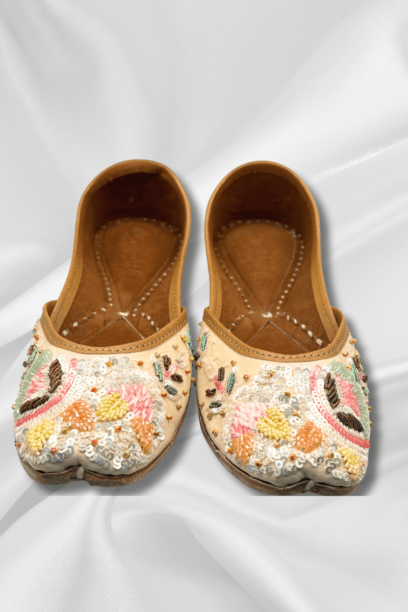 Pastel Jutti - Beige Khussa Shoes with vibrant floral embroidery and sequin detailing, ideal for festive wear and Haldi ceremonies.