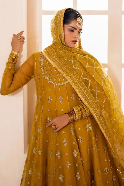Baroque chiffon designer outfit with gold embroidery and net dupatta, styled for traditional Pakistani formal events.