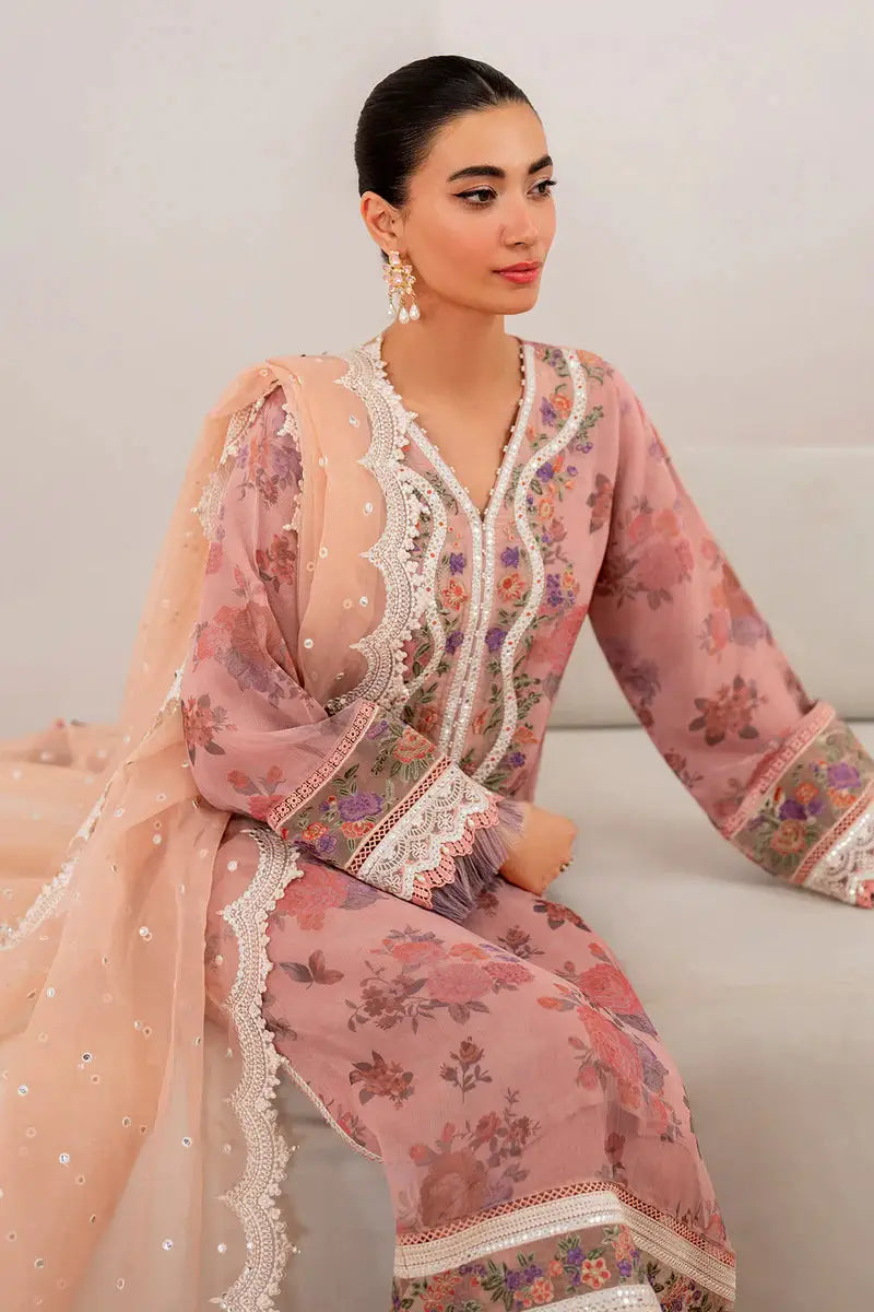 Model seated in EMBROIDERED CHIFFON-SF-705 pink suit showcasing intricate embroidery, floral print, and scalloped chiffon dupatta.