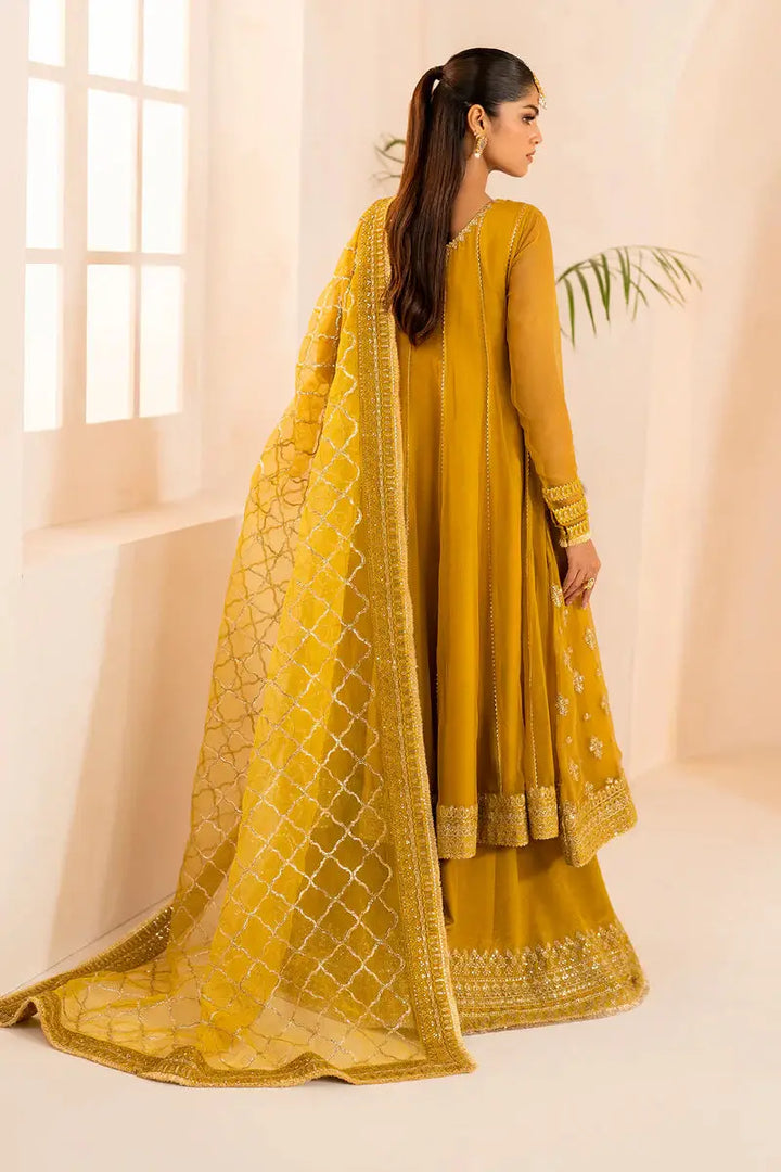 Back view of Baroque embroidered chiffon outfit in mustard with detailed organza dupatta and dyed silk trousers for formal occasions.
