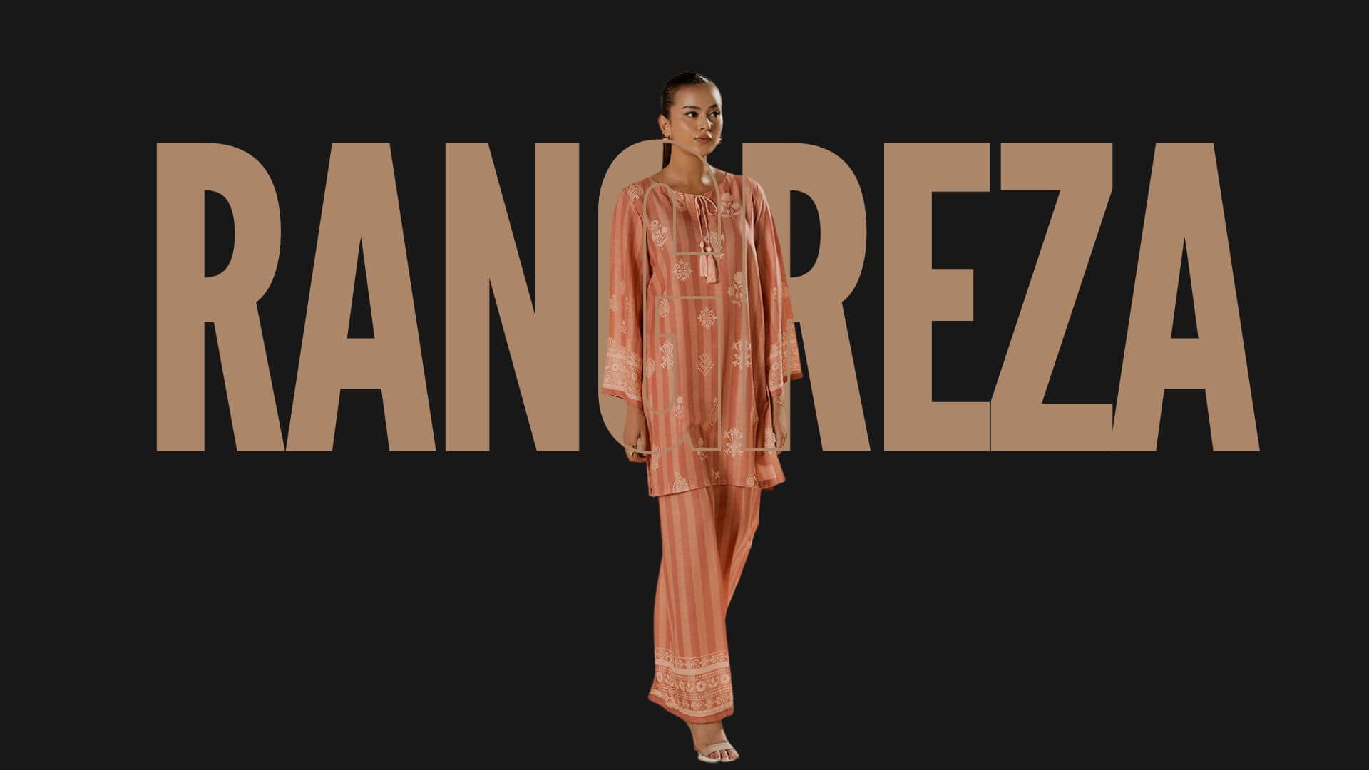 Woman in a pink Pakistani Casual outfit standing in front of the 'Rangreza' brand name on a black background