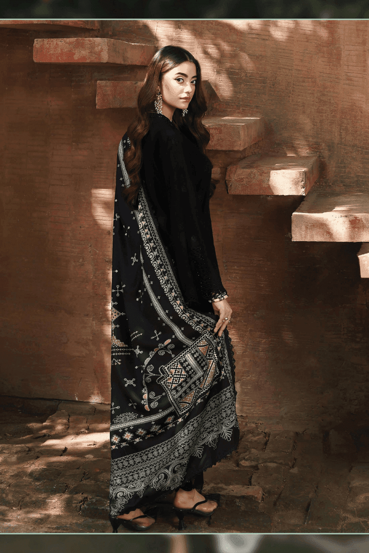 Back view of AL-1128 Pakistani clothing set showcasing detailed digital prints on wool shawl and elegant black chikankari shirt.