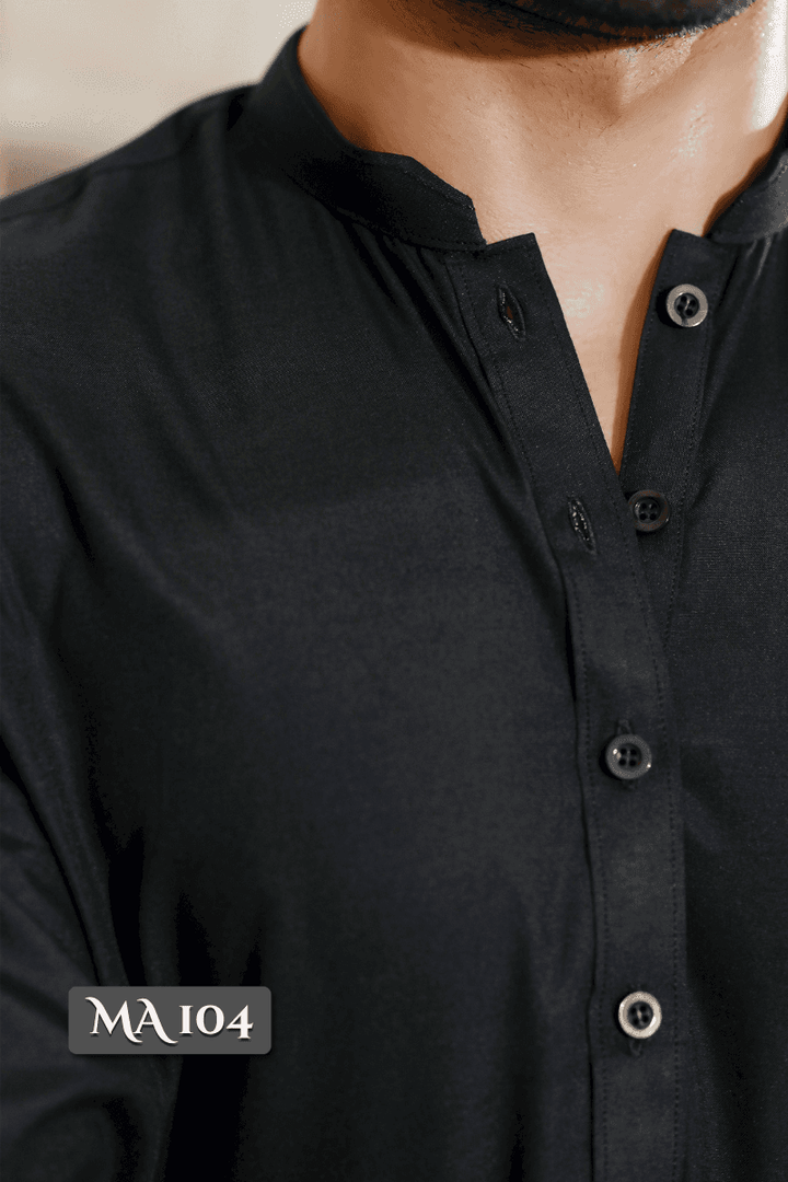 Close-up of MA-104 Black Kameez Shalwar showcasing detailed buttons and blended Ban Collar, crafted for refined traditional style.