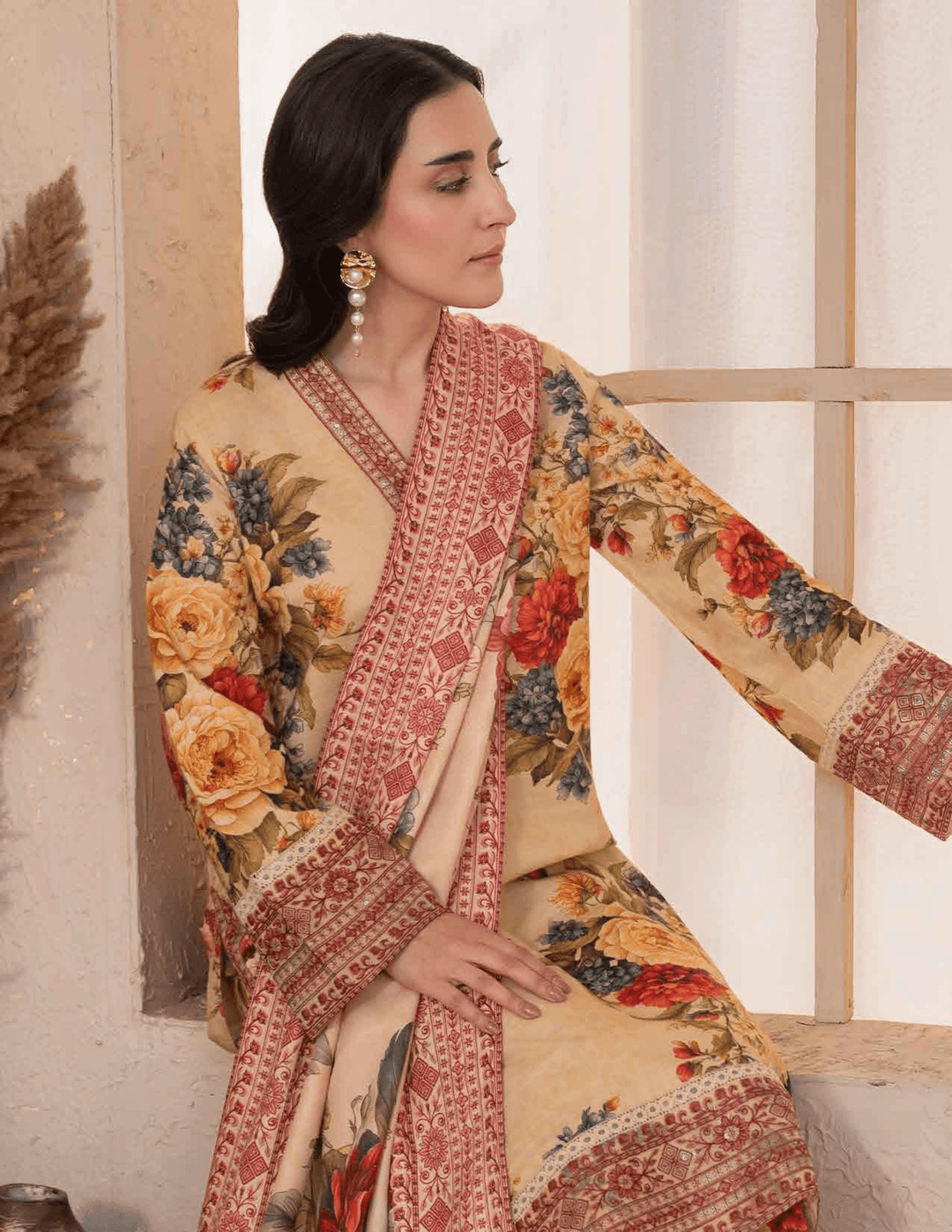 Close-up of RANGREZA ML-194-5402 stitched winter outfit featuring detailed embroidery on khaddar fabric with vibrant floral and ethnic patterns.