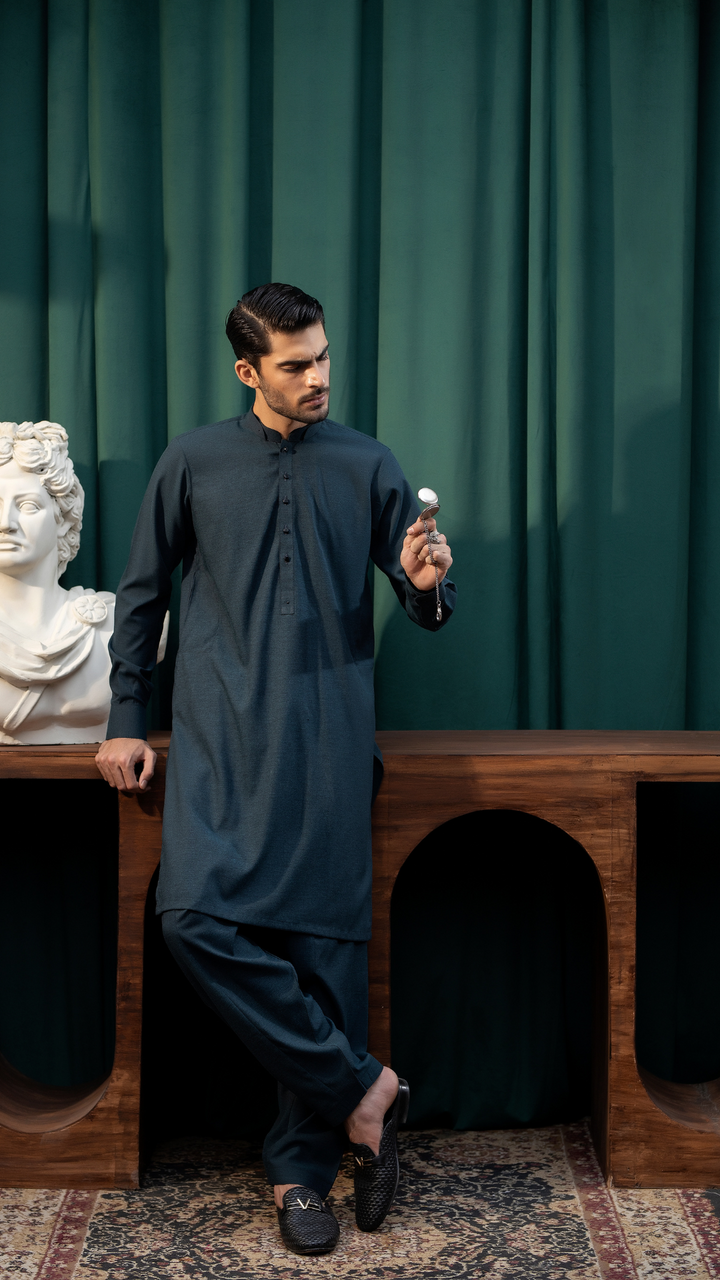 Men By Rangreza MA-05-55 dark blue kurta pajama set with buttoned placket, styled in an elegant indoor setting.