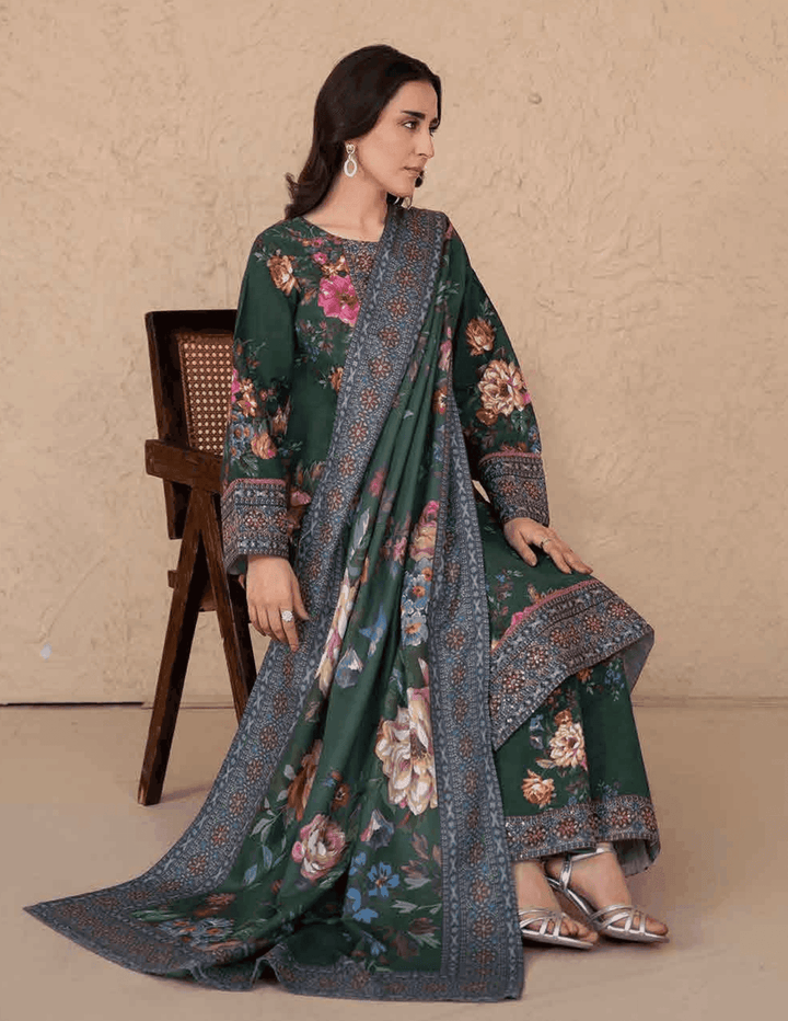 Seated model wearing RANGREZA ML-195-5401 festive Pakistani winter wear with printed shawl draped over floral kurta and pants.
