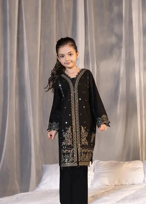 Girl in black embroidered festive dress with dupatta and jewelry