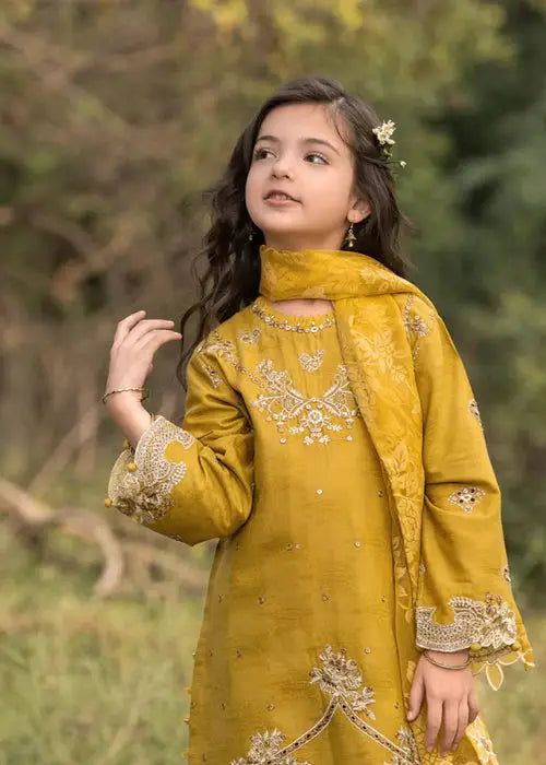 Girl in yellow embroidered traditional dress with floral accessories