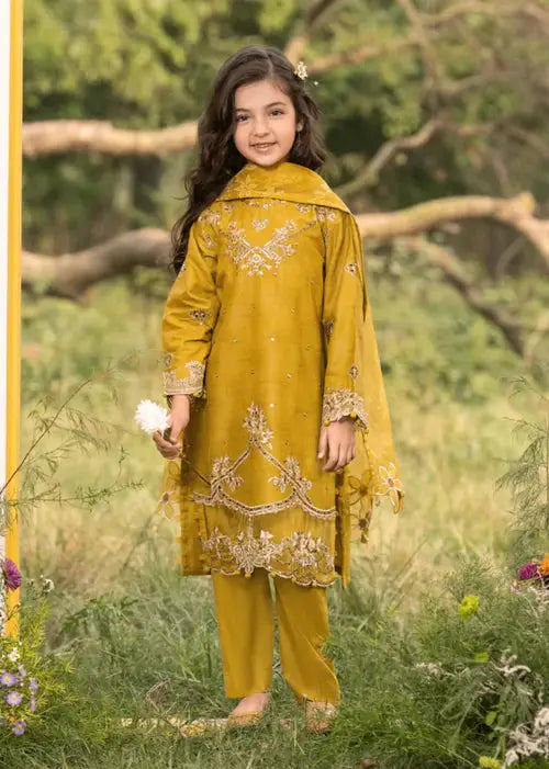 Girl in yellow embroidered traditional dress outdoors