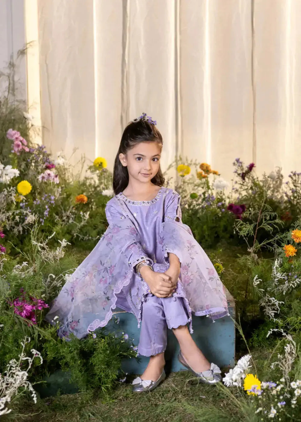 Front view of lavender embroidered kid kurta with floral dupatta and pants