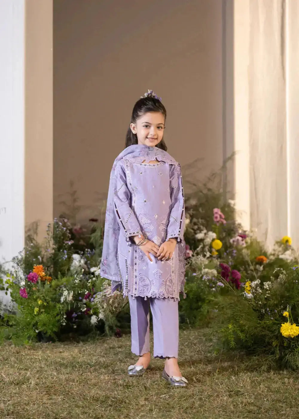 Back view of lavender embroidered kid kurta with floral dupatta and pants