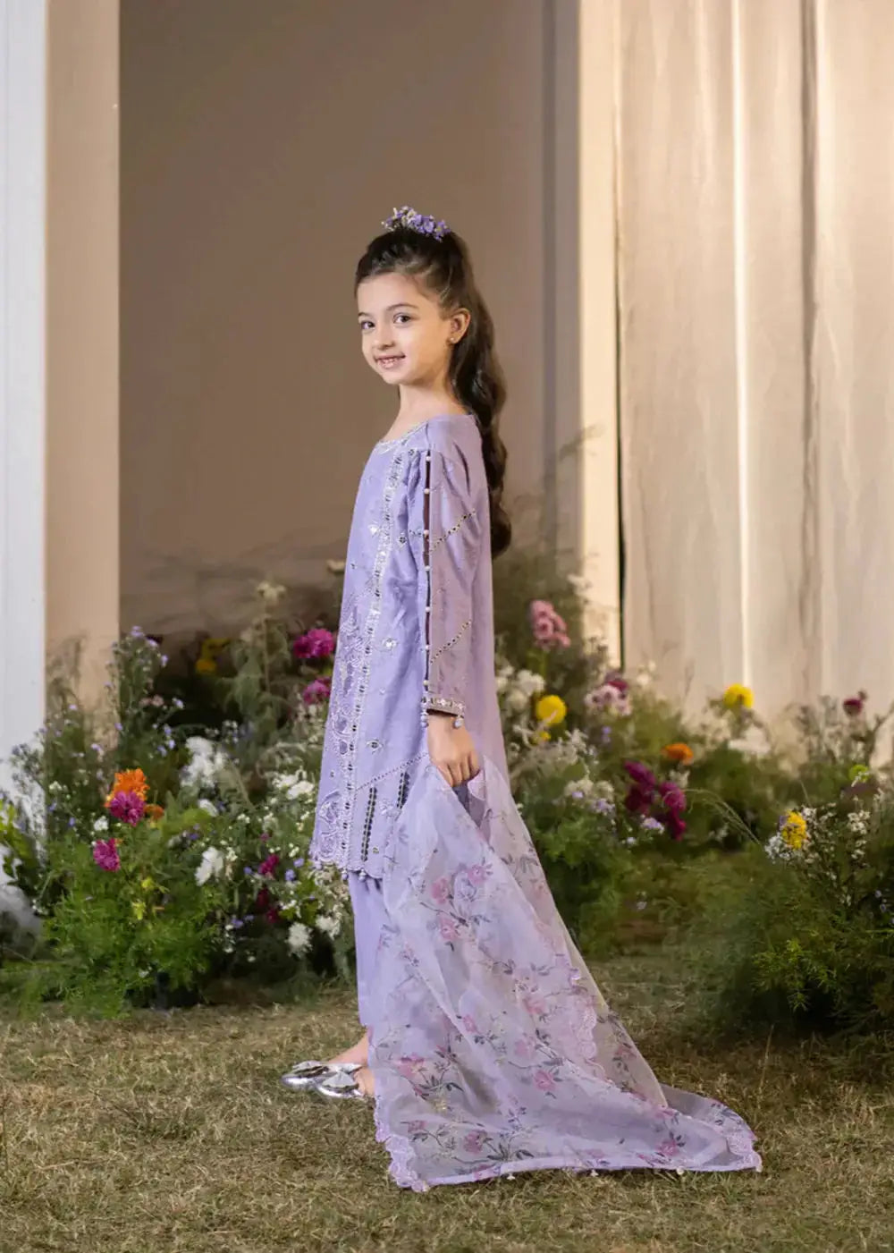 Side view of lavender embroidered kid kurta with floral dupatta and pants