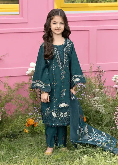 Young girl in dark green embroidered traditional dress with floral garden background