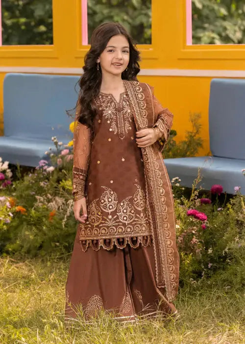 Young girl in brown traditional embroidered dress with dupatta, floral garden background