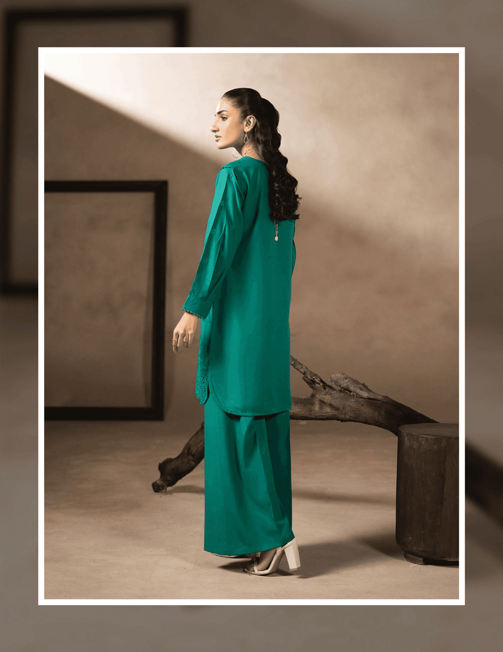 Back view of RANGREZA EA-47-3802 winter wear set showing the elegant fall of the green kurta and matching wide-leg trousers in Dhanak fabric.