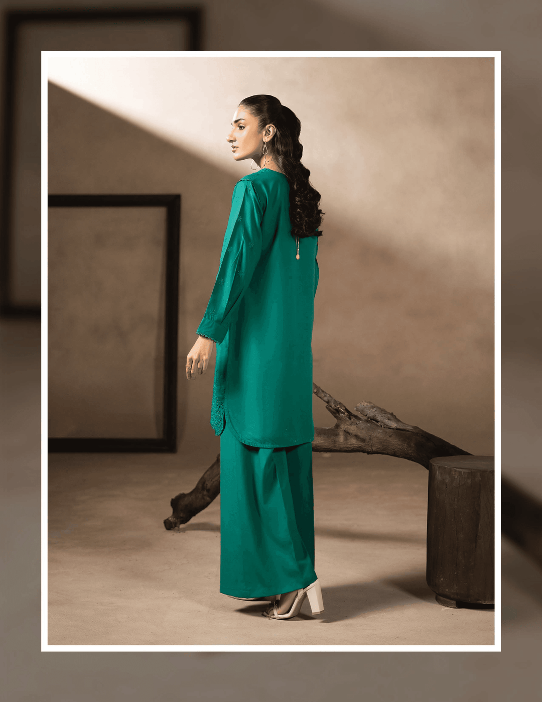 Back view of RANGREZA EA-47-3802 winter wear set showing the elegant fall of the green kurta and matching wide-leg trousers in Dhanak fabric.