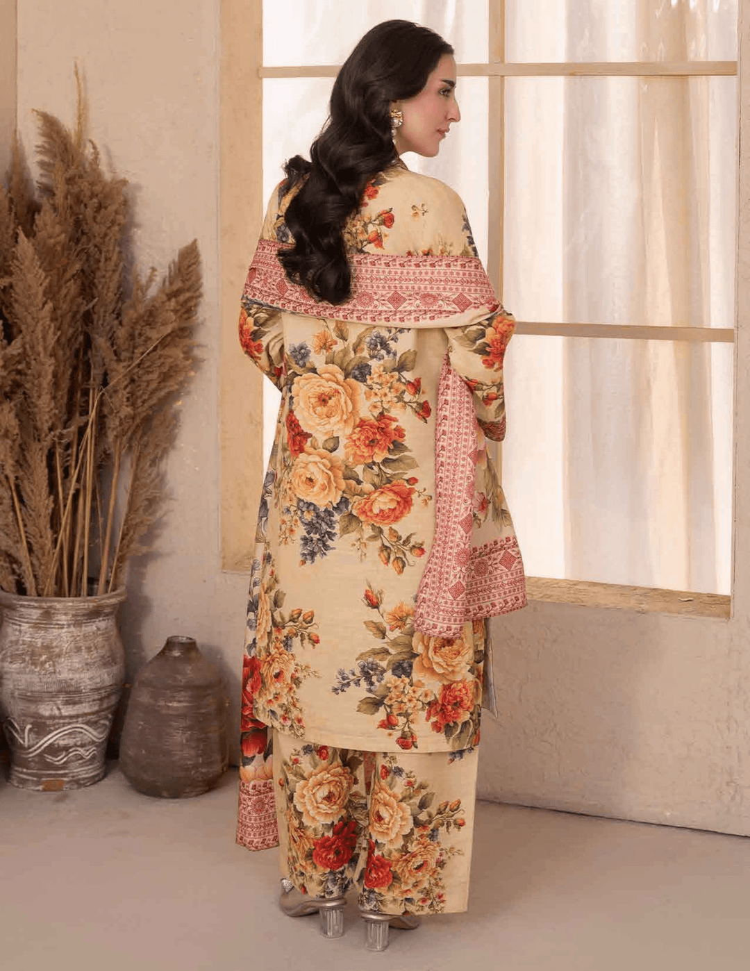 Back view of RANGREZA ML-194-5402 3-piece winter set showing floral printed khaddar shirt and trousers with red patterned shawl draped elegantly.