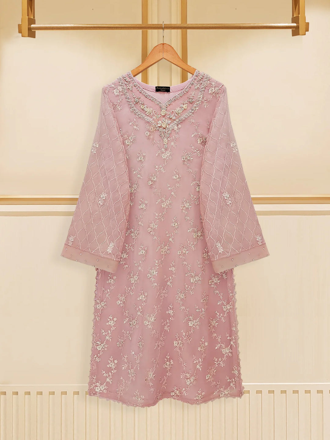 Front view of Agha Noor embroidered chiffon suit on hanger