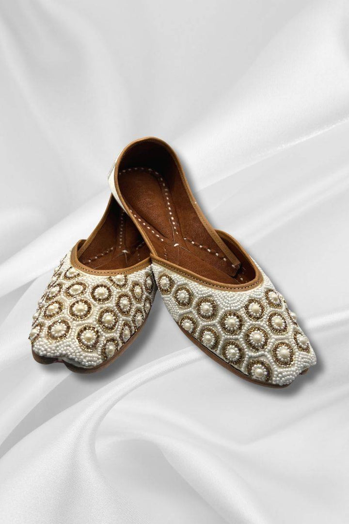 Kohinoor Ivory Jutti with pearl and bead embellishments, elegant khussa shoes for ladies, ideal for bridal and formal wear.