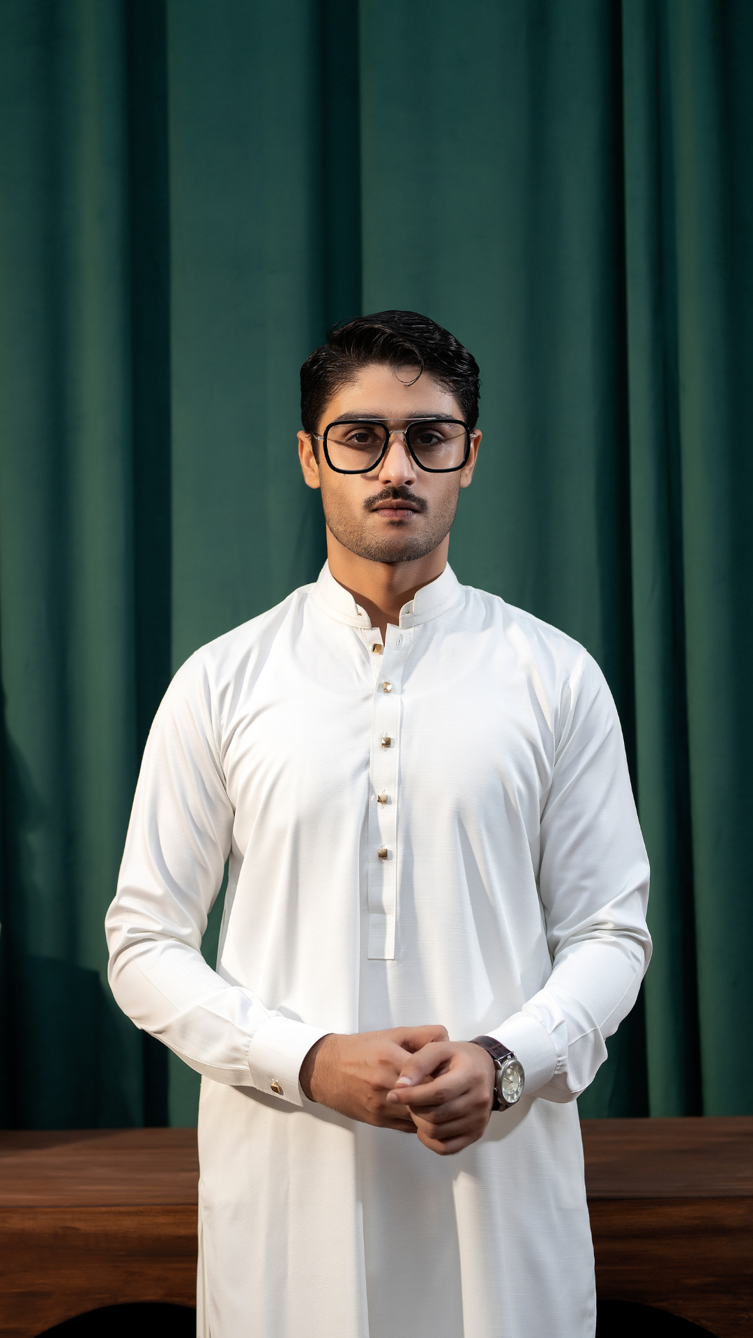 Close-up front view of white men's kurta pajama by Rangreza, highlighting the buttoned neckline and premium fabric.