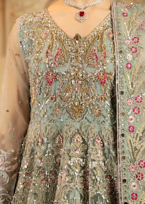 Close-up of embroidered neckline and bodice on pastel green Wedding Maxi Dress with gold and pink detailing.