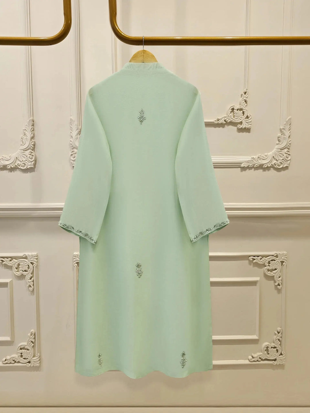 Back view of Agha Noor 3 Piece Cotton Net Suit showcasing minimal embroidery and elegant tailoring in soft mint green.