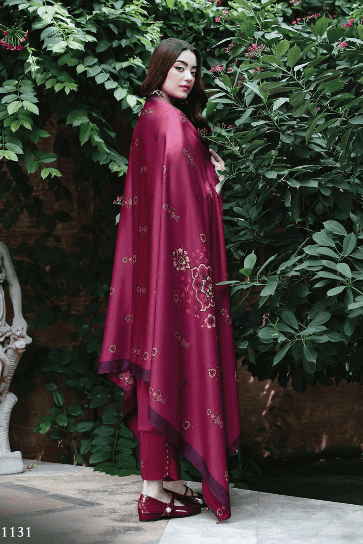 Side view of RANGREZA AL-1131 Pakistani womens clothes with floral wool shawl draped over embroidered maroon shirt and pants.