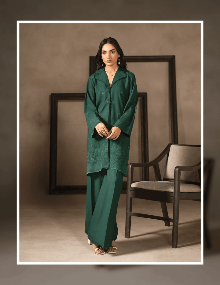 Shop RANGREZA EA-49-3804, a stylish green Pakistani two piece set featuring a long embroidered shirt and wide-leg pants for casual winter fashion.