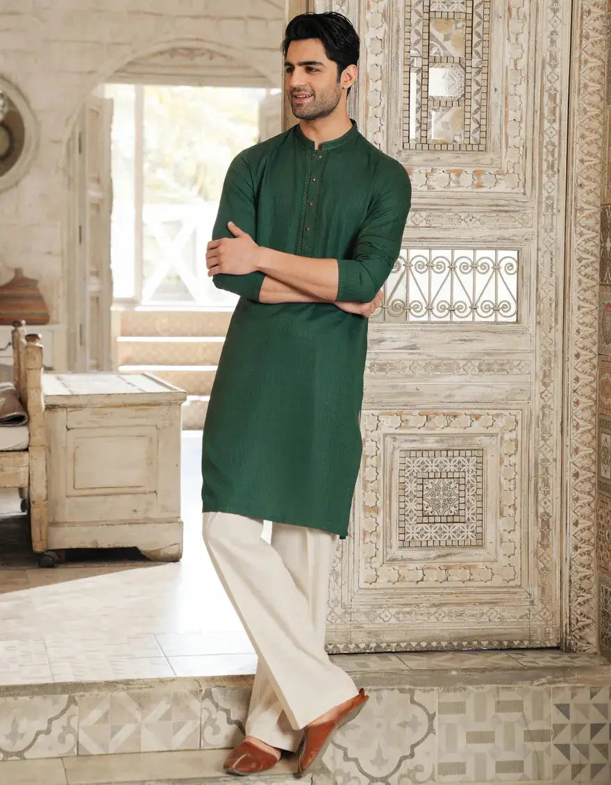 Green Kurta - Semi-Formal Fit from Festive Collection, styled with white trousers and brown loafers in a traditional indoor setting.