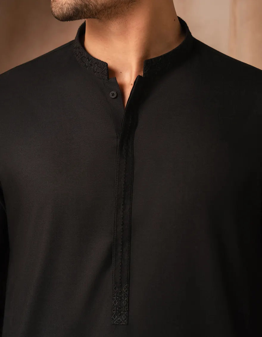 Detailed view of black semi-formal men's kurta collar and placket, showcasing fine stitching and blended fabric texture. Stylish ethnic wear.