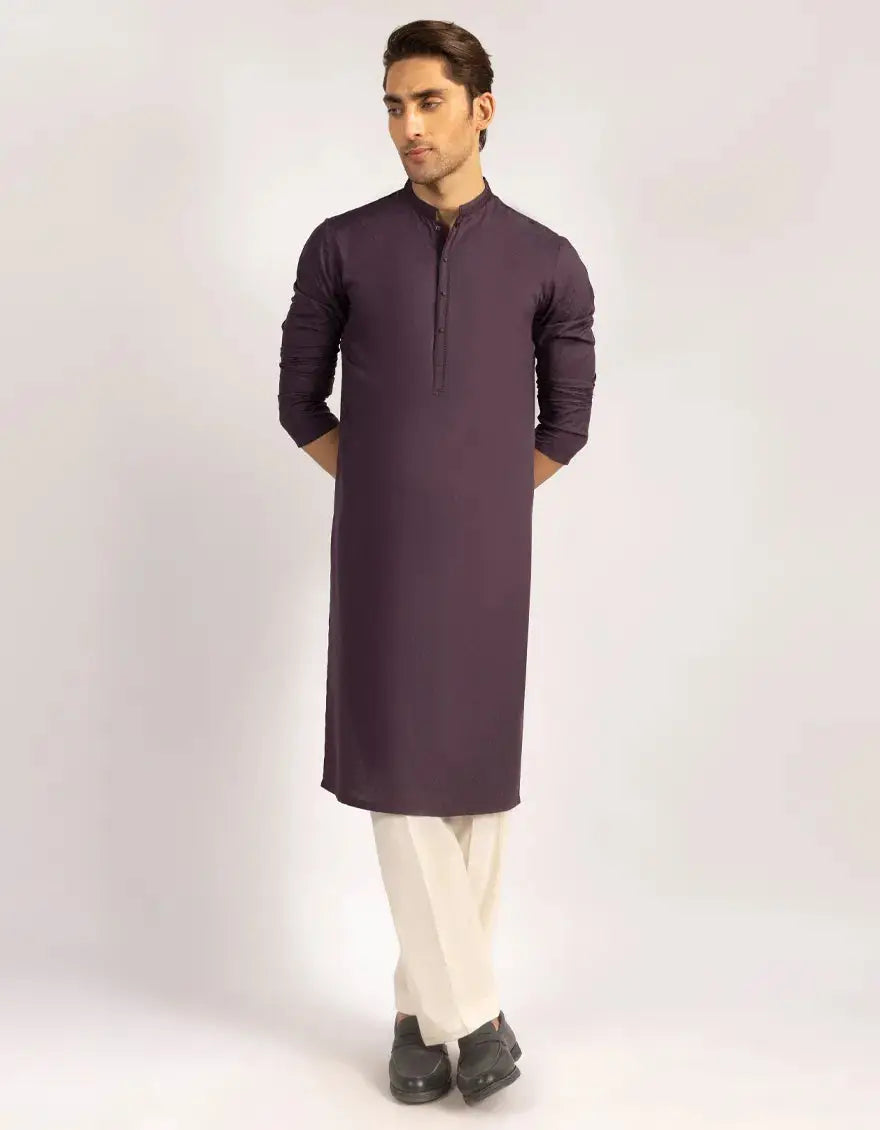 Junaid Jamshed Purple Semi-Formal Kurta styled with white trousers, highlighting its modern fit and classic ethnic design.