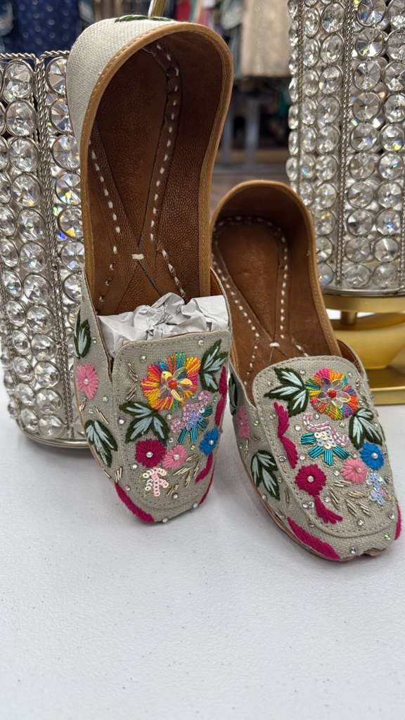 Khaas Multi Jutti women's khussa shoes with vibrant floral embroidery on a grey base, handcrafted for elegance in flats footwear category.