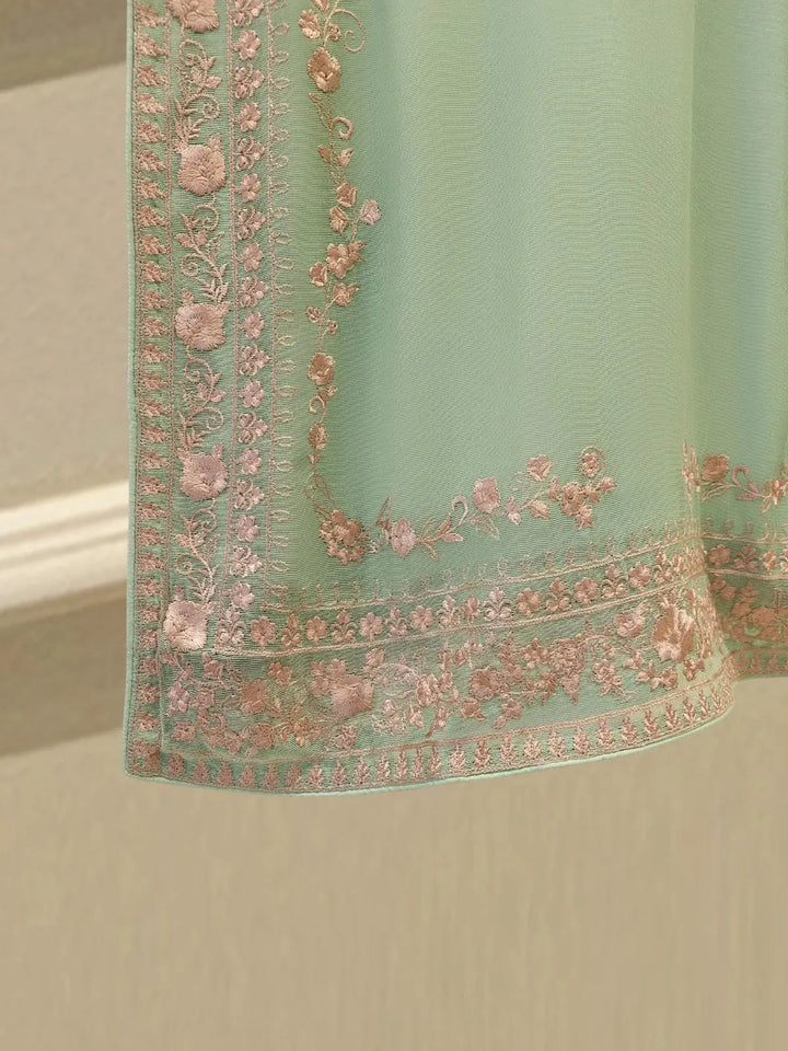 Detailed hem embroidery of AGHA NOOR Cotton Suit featuring floral pink threadwork on mint green fabric, enhancing the traditional appeal.