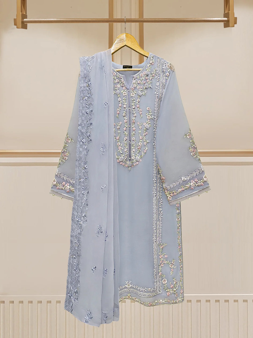 Elegant embroidered chiffon suit with dupatta on hanger