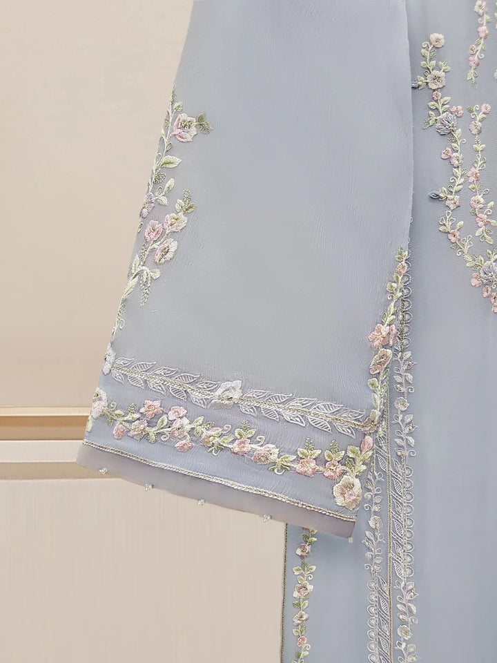 Close-up of floral embroidery on chiffon sleeve