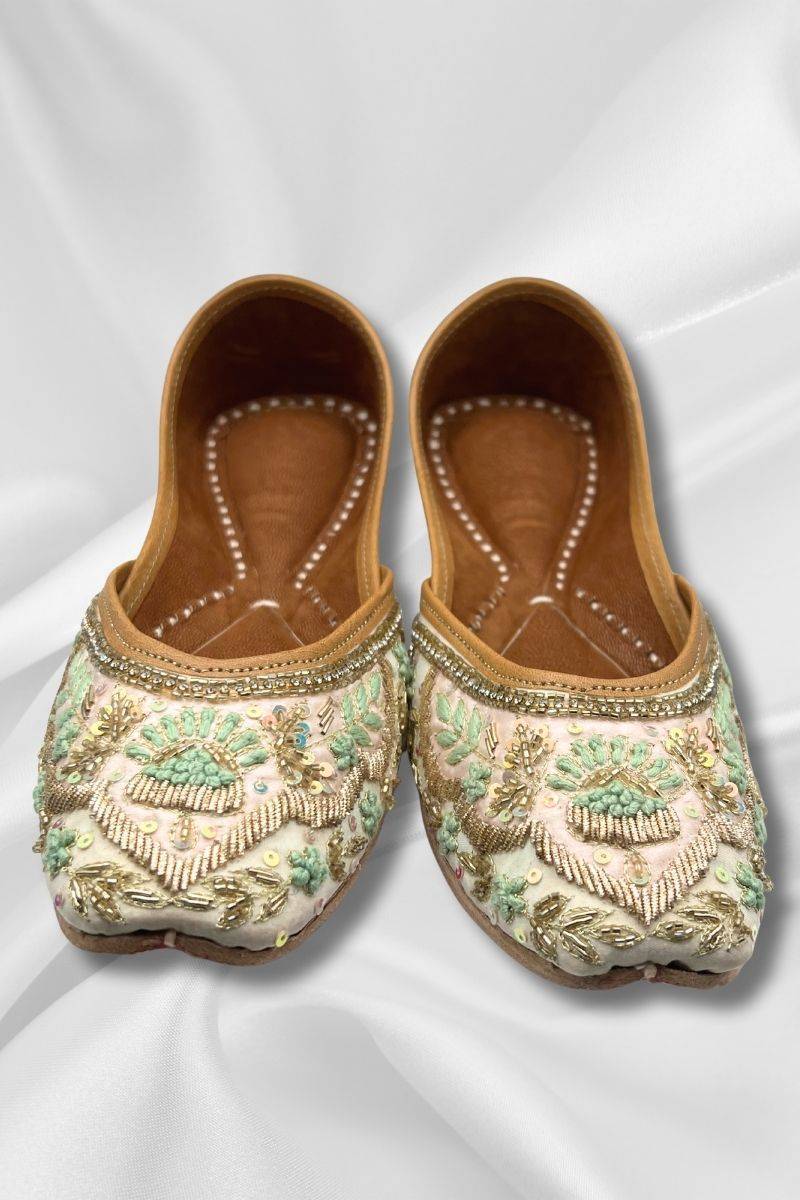 Front view of Zari Offwhite Khussa - traditional Pakistani flat shoes with ornate teal and gold embroidery, ideal for weddings and cultural events.