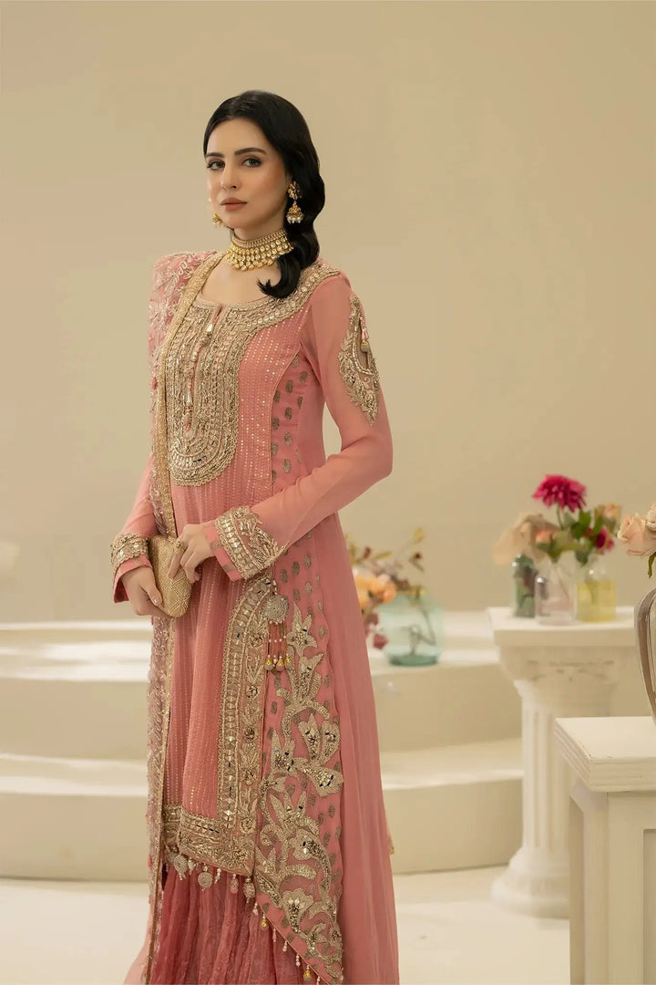 Close-up of KHUDA BAKSH M-109 Pink showcasing intricate hand embroidery on the neckline and sleeves of the shirt.