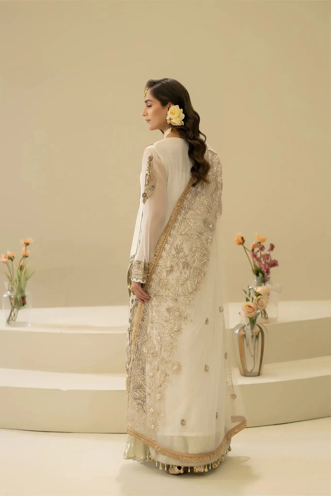 Back view of M-109 OFF-WHITE Pakistani dress with detailed embroidery on dupatta and sleeves, showcasing traditional craftsmanship.